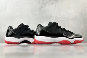 Nike Air Jordan 11 Low Bred black red white patent leather sneakers with translucent outsole