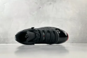 Nike Air Jordan 11 Retro Bred black patent leather mesh sneakers with red accents and white midsole