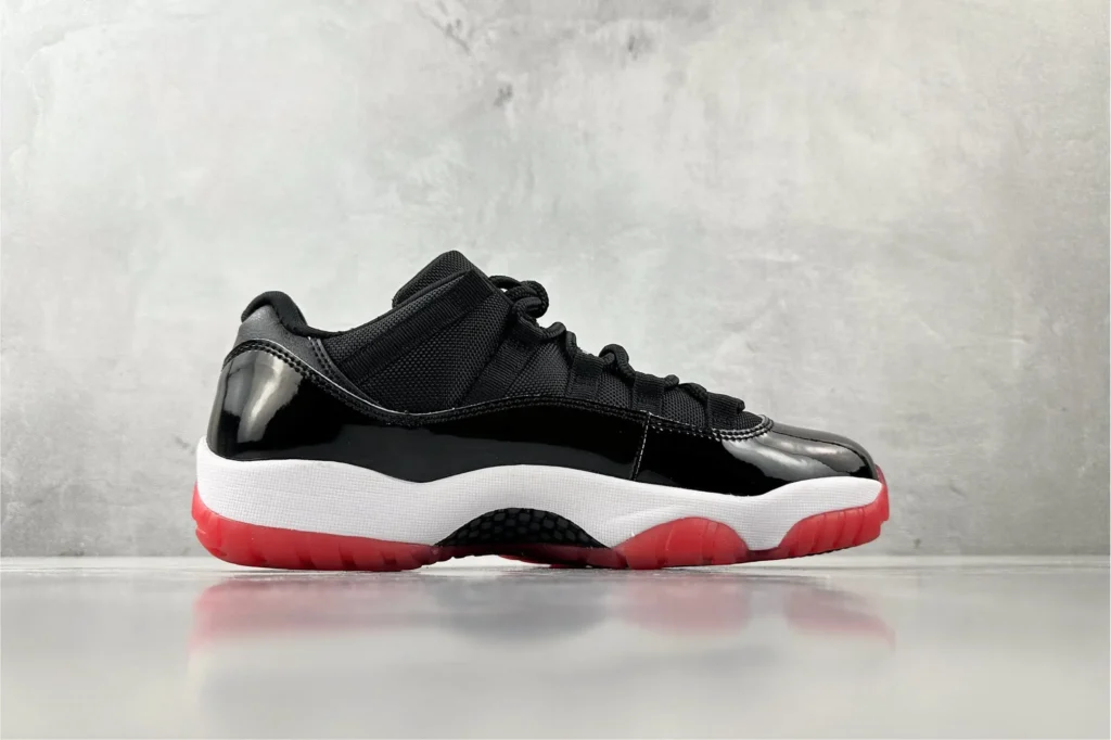 Nike Air Jordan 11 Low Bred black red white patent leather sneakers