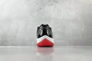 Nike Air Jordan 11 Retro Bred black red patent leather sneakers with white midsole and red outsole