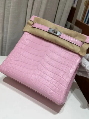 Hermès Kelly 28 Bag pink crocodile leather with palladium hardware and beige protective felt cover