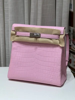 Hermès Kelly 32 pink alligator leather handbag with silver hardware and beige protective felt cover