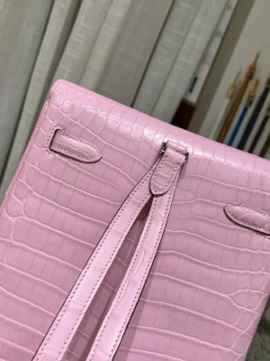Hermès Kelly Ado backpack medium pink crocodile leather luxury bag