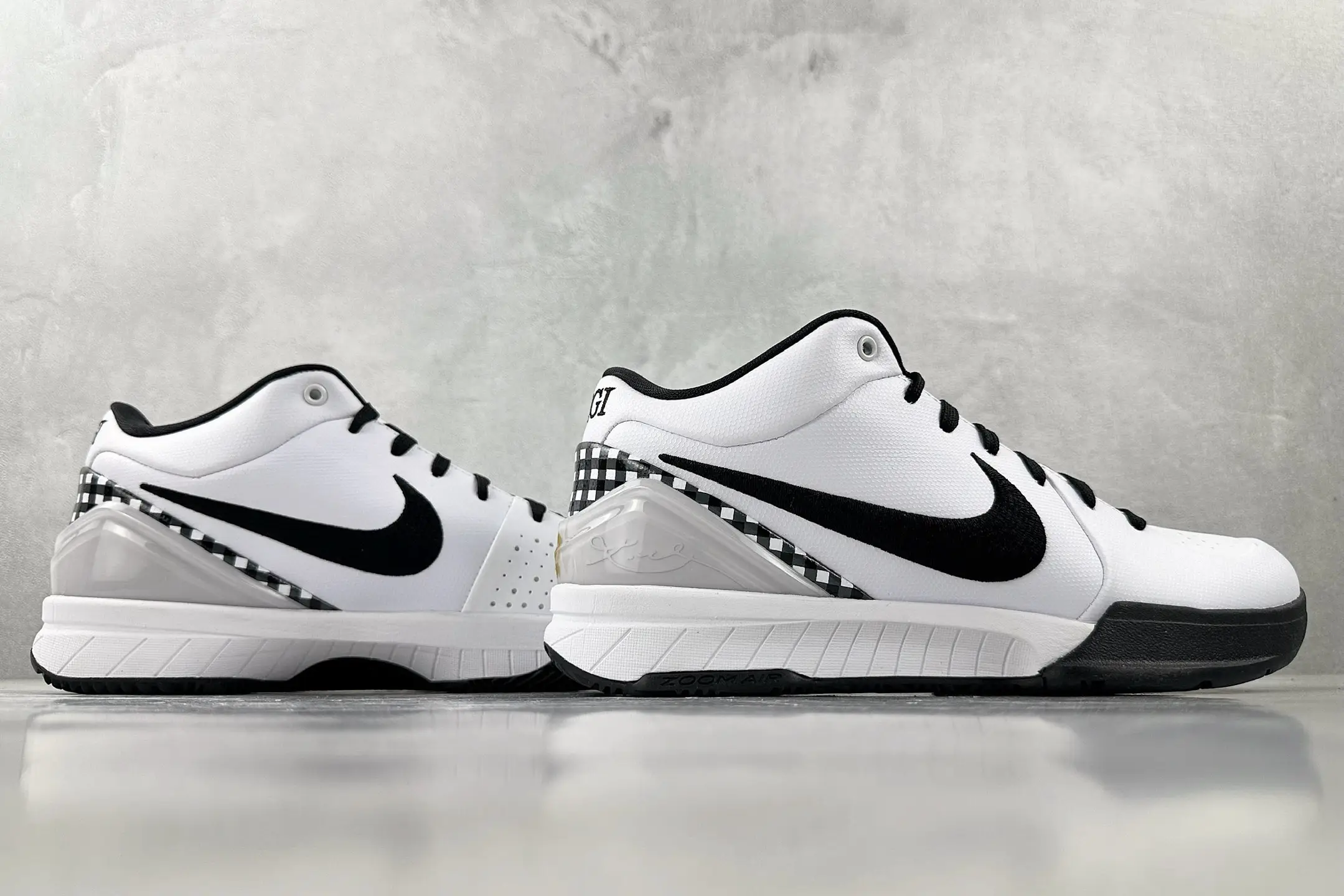 Nike Zoom Kobe 4 "Mambacita" G shoes in white and black with signature details, showcasing a sleek design and prominent Nike logo.