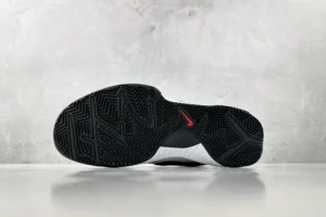 Nike Zoom Kobe 4 "Mambacita" G shoe sole with textured black rubber and red logo detail, showcasing design features relevant to sneaker enthusiasts.
