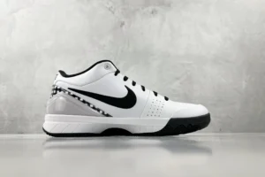 Nike Zoom Kobe 4 "Mambacita" G sneaker in white and black, showcasing side profile and distinctive design elements, featured on an e-commerce product listing.