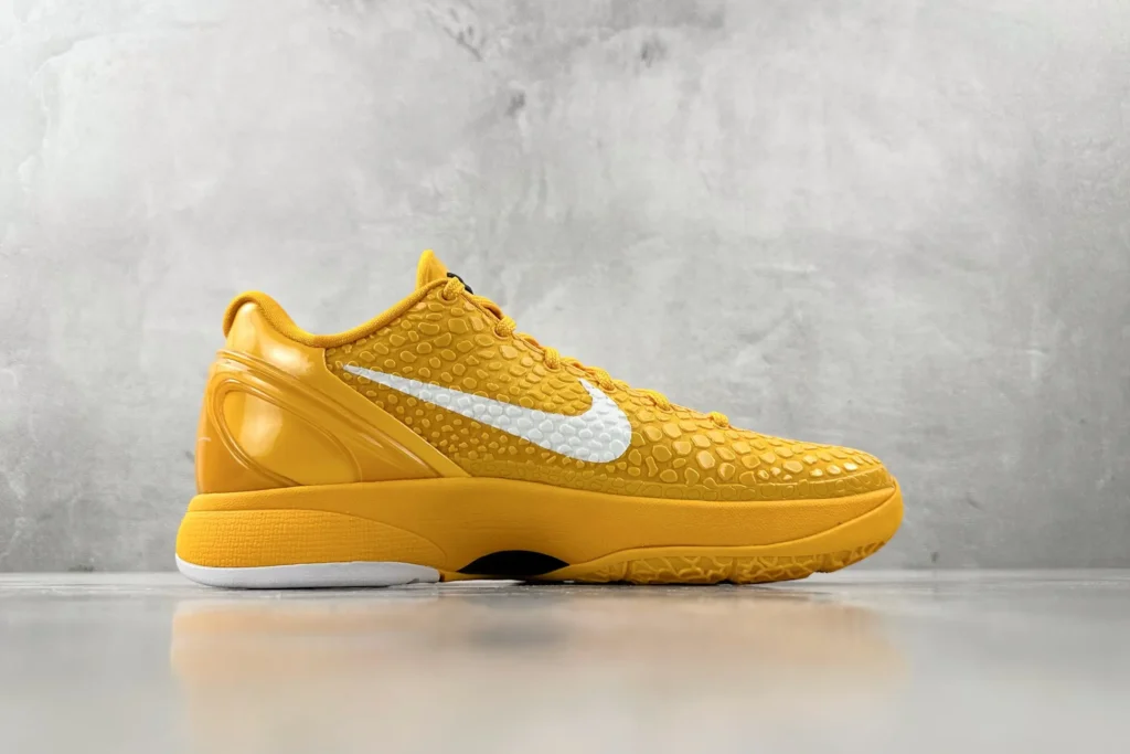 Nike Zoom Kobe 5 Protro University Gold white leather sneakers with textured upper