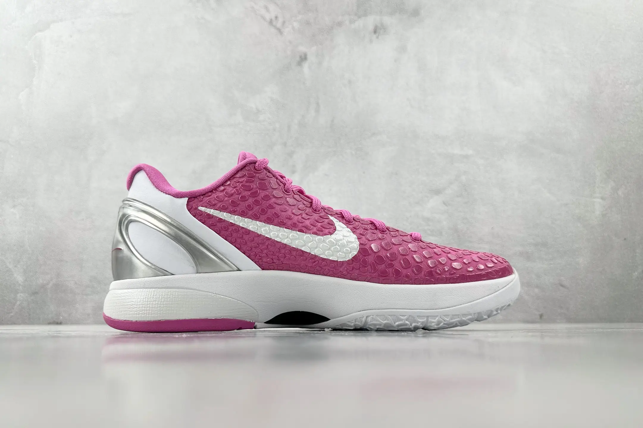 Nike Air Zoom Vapor X pink white silver synthetic mesh sneakers with textured upper and cushioned sole