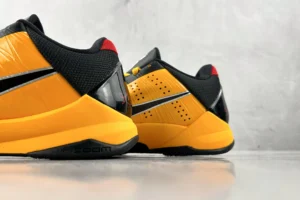Nike Zoom Kobe 5 Protro black red yellow synthetic leather sneakers with visible Zoom cushioning