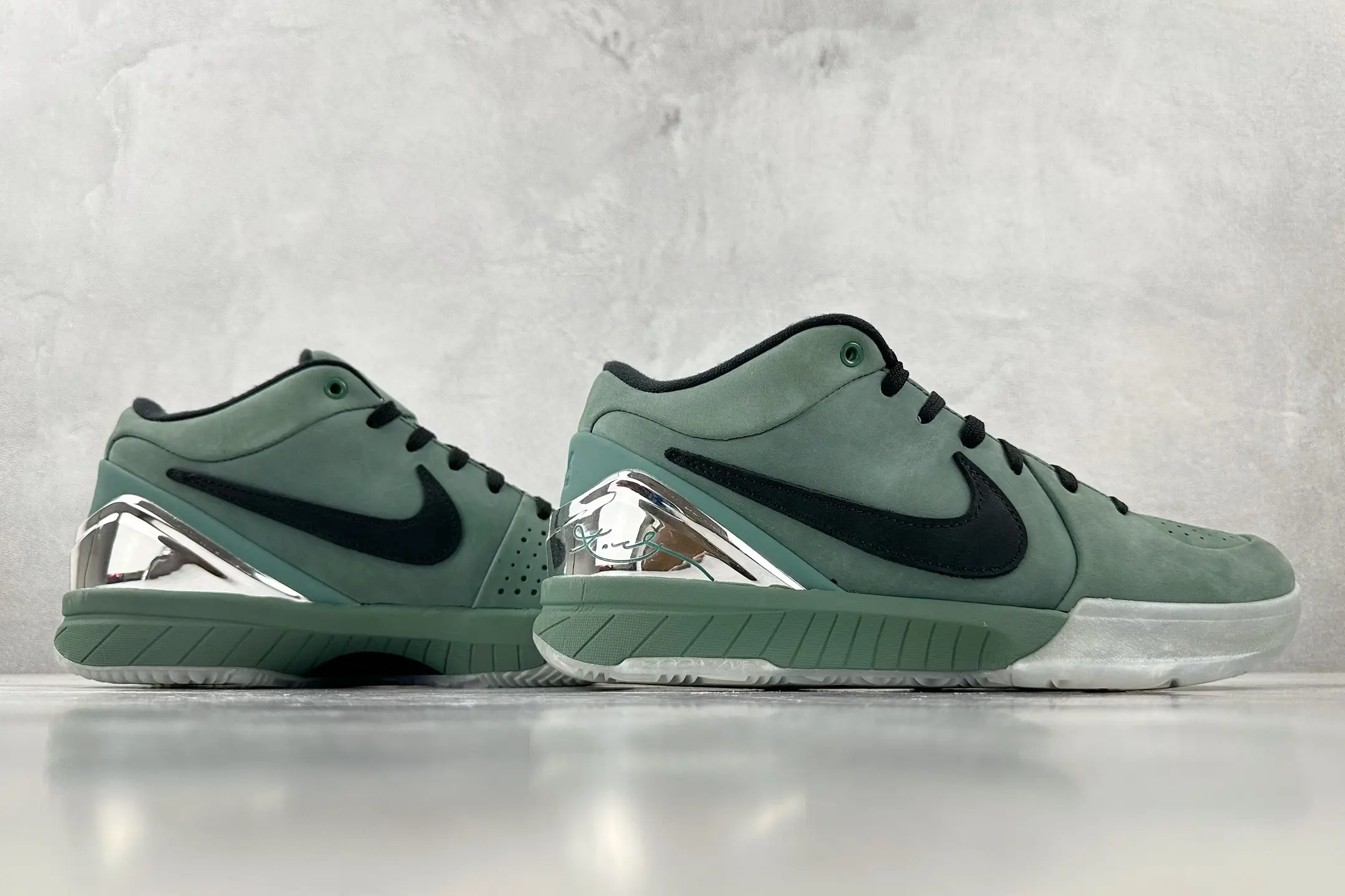Nike Zoom Kobe IV Protro teal green black leather sneakers with silver heel accents