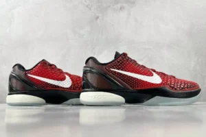 Nike Zoom Kobe 6 Protro "All-Star" sneakers in red and black colorway, featuring signature white Swoosh logo, side profile view, showcasing textured upper design and translucent sole.