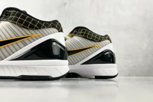 Nike Zoom Kobe IV Protro black yellow white synthetic sneakers with grid pattern mesh collar