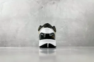 Nike Air Jordan 12 Retro Taxi black white yellow leather sneakers rear view