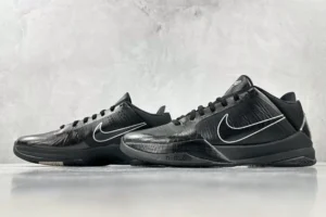 Nike Zoom Kobe 5 Black Knight sneakers in black with white accents, showcasing a sleek design and textured surface, ideal for sneaker enthusiasts and collectors.