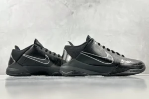 Nike Zoom Kobe 5 Black Knight sneakers displayed from the side, featuring a sleek black design with silver accents and the Nike logo, highlighting their sporty aesthetic and appeal for sneaker enthusiasts.