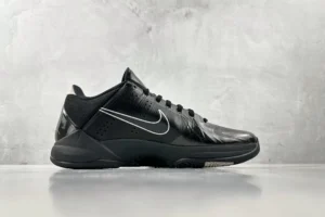 Nike Zoom Kobe 5 Black Knight sneakers displayed in profile view, featuring a sleek black design with silver accents, ideal for sneaker enthusiasts and potential buyers.