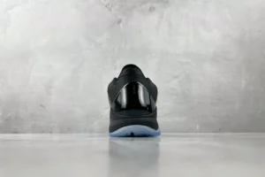 Nike Air Jordan 11 Concord black white patent leather sneakers with translucent sole viewed from heel