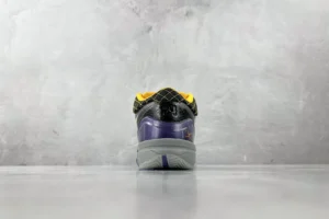 Nike Air Jordan 11 Retro black yellow purple synthetic leather sneakers rear view