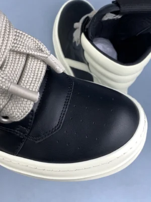 Alexander McQueen Oversized Sneaker black ivory leather sneakers with chunky sole and wide laces