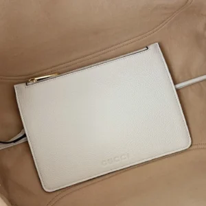 Gucci leather pouch white pebbled leather zipper closure minimalist design accessory