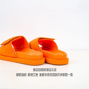 Orange Louis Vuitton Miami Damier Round Head One Word Slippers showcasing luxury footwear design and craftsmanship.