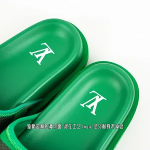 Louis Vuitton slides green rubber sandals with white LV logo cushioning and textured footbed material
