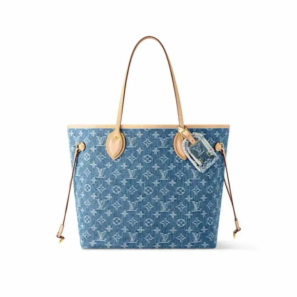 Louis Vuitton denim tote bag with leather accents and charm, featured on RepsGoat's tote bags collection.