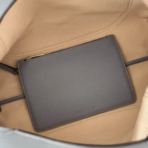 Gucci small pouch gray color pebble leather wristlet bag with gold zipper detail inside tote