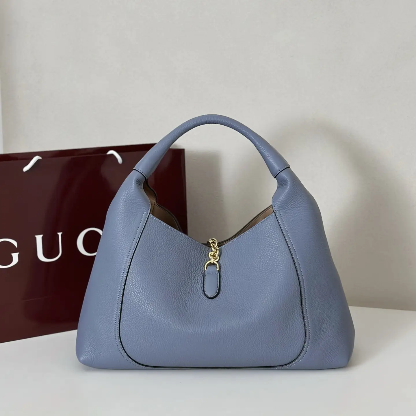 Gucci Jackie 1961 medium blue pebble leather hobo bag with gold clasp detail