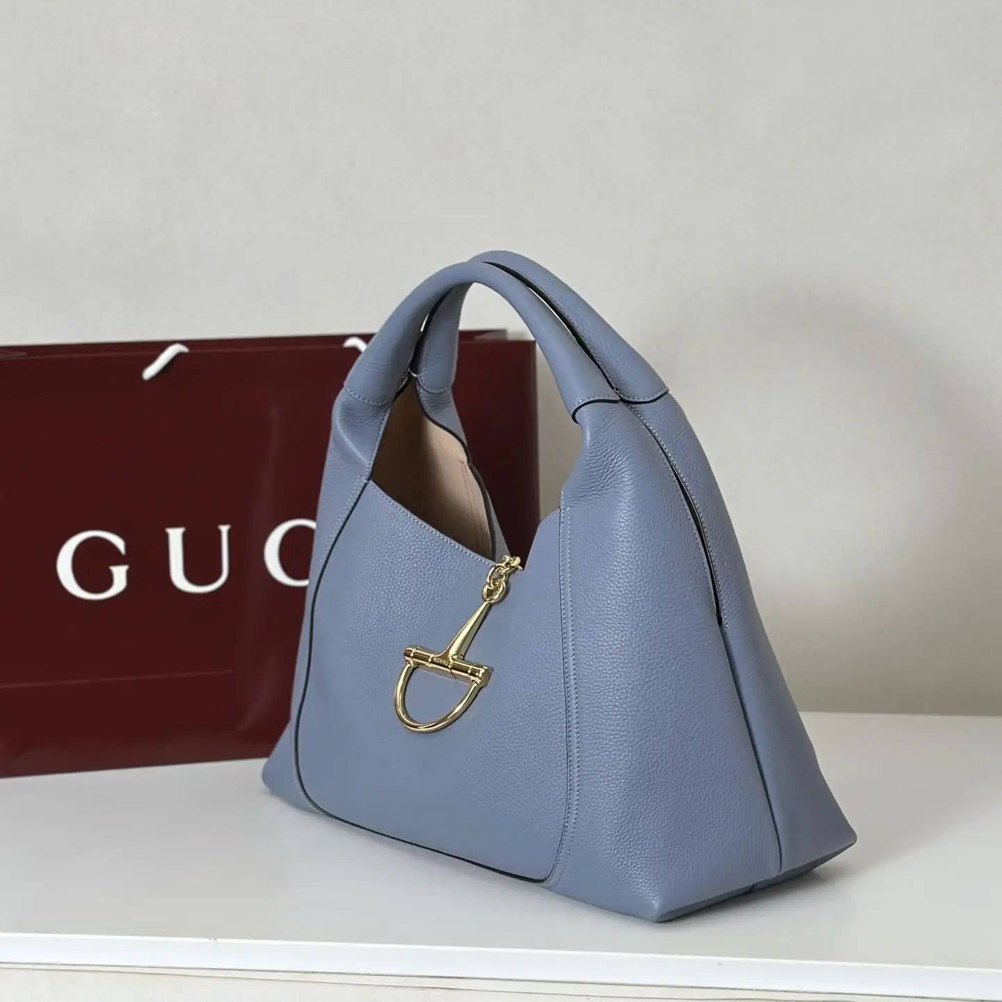 Gucci Jackie 1961 medium blue leather hobo bag with gold hardware buckle detail