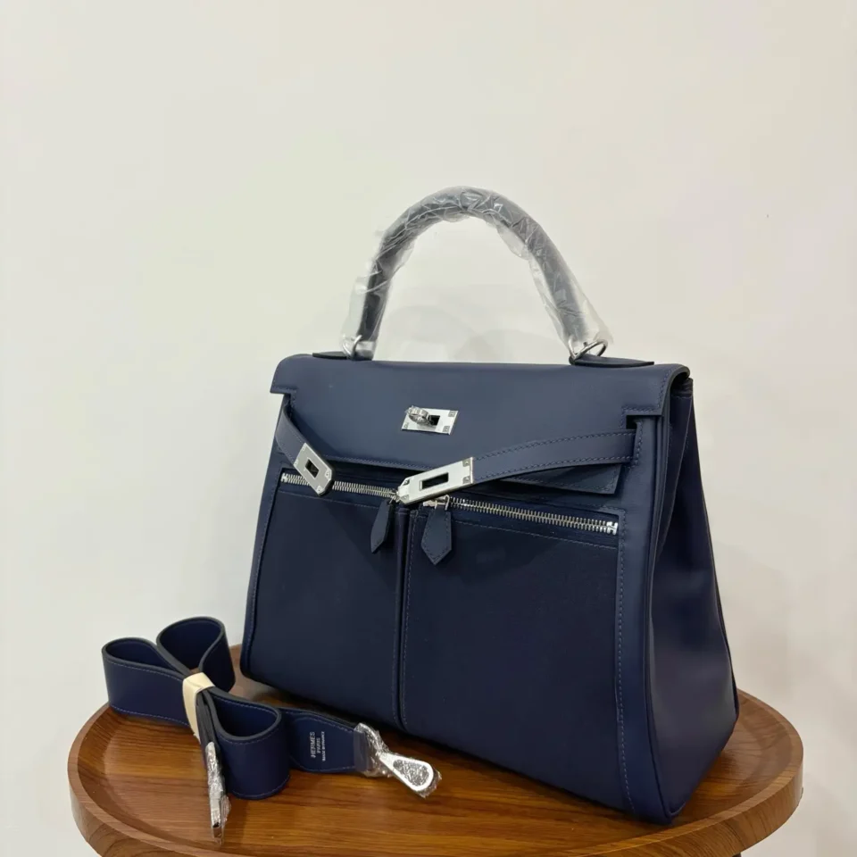 Hermès Kelly 32 navy blue calf leather and canvas handbag with silver hardware and detachable strap