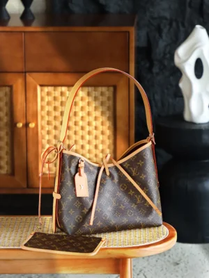 Louis Vuitton Carryall Trumpet M46203Chip handbag on a wooden table, featuring the signature monogram pattern and leather accents, with a matching wallet beside it.