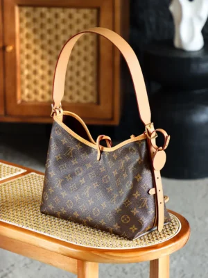 Louis Vuitton Carryall Trumpet M46203Chip handbag on a wooden table, featuring the iconic monogram pattern and leather strap, showcasing luxury craftsmanship and design.