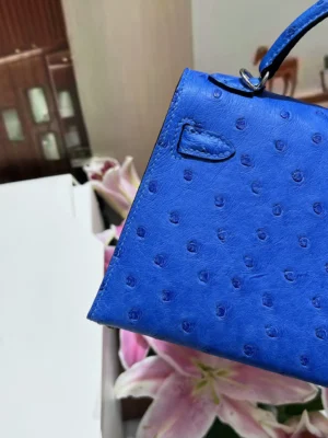 Hermes Kelly 25 blue ostrich leather handbag with top handle and silver hardware