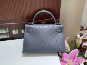 Hermès Kelly 25 blue ostrich leather handbag with top handle and silver hardware