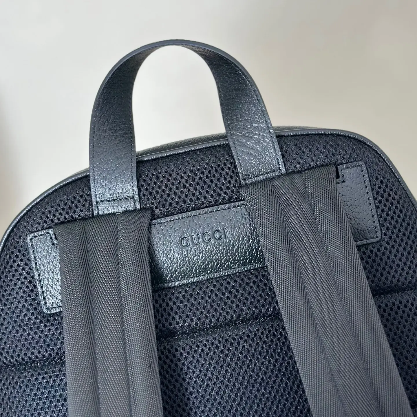 Gucci backpack medium black mesh and leather material with adjustable straps and carry handle