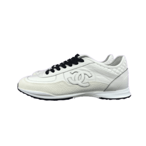 Chanel 25P series casual sports shoes in pure white, featuring black laces and iconic logo, showcasing luxury sneaker design.