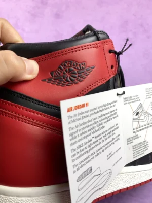 Nike Air Jordan 1 High OG Bred black red leather sneakers with classic retro design and embossed logo