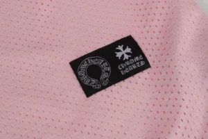 Chrome Hearts clothing tag black fabric white Gothic logo on pink mesh fabric material