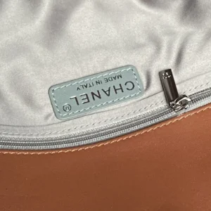 Chanel bag interior label beige fabric lining silver zipper brown leather trim