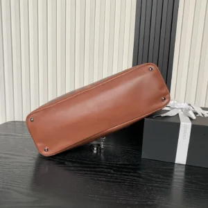 Chanel Classic Flap Medium A01112 brown smooth leather flap bag with silver hardware feet bottom view