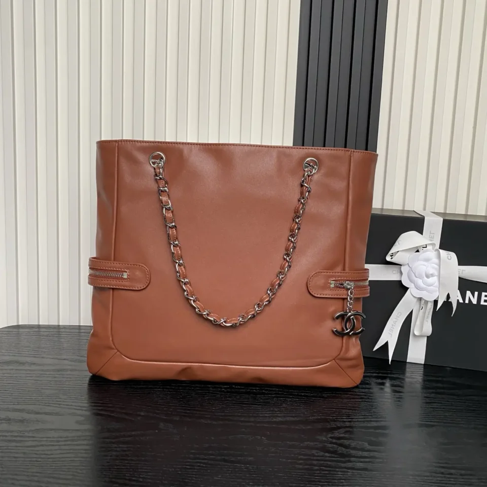 Chanel tote bag brown leather medium size silver chain strap zippered detailing with CC charm