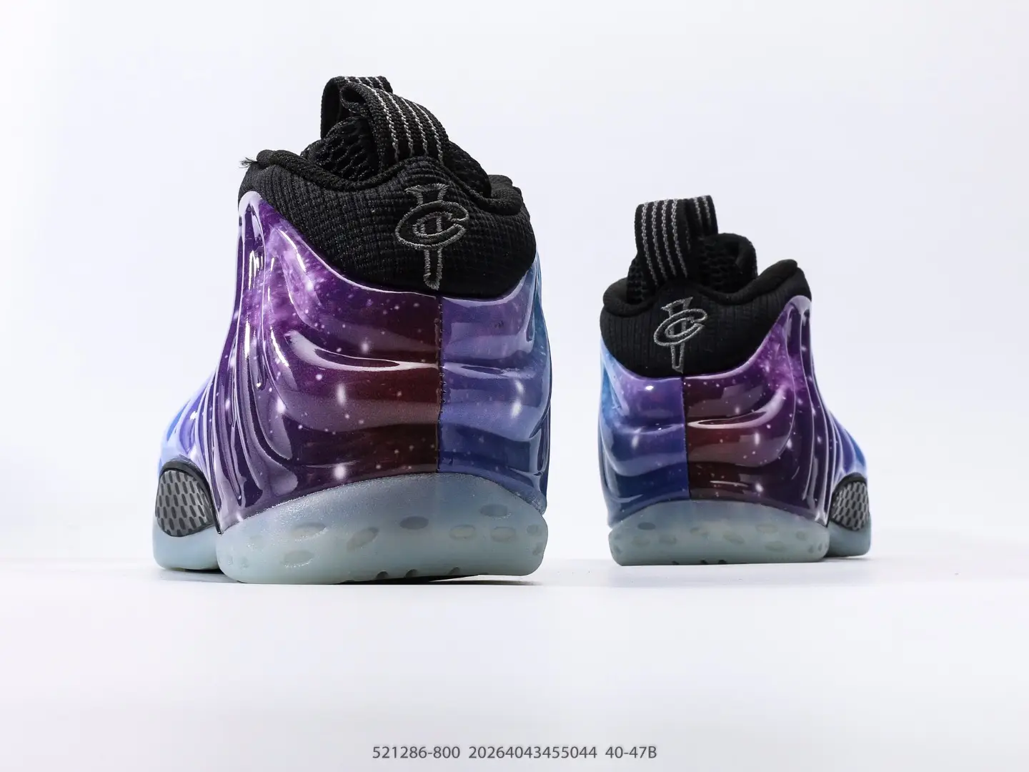 Nike Air Foamposite One NRG sneakers featuring a galaxy-inspired design, showcasing vibrant purple and blue hues with black accents and textured detailing.