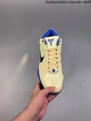 Nike Kobe 6 Protro yellow black blue synthetic sneakers with perforated toe box and signature logo on tongue