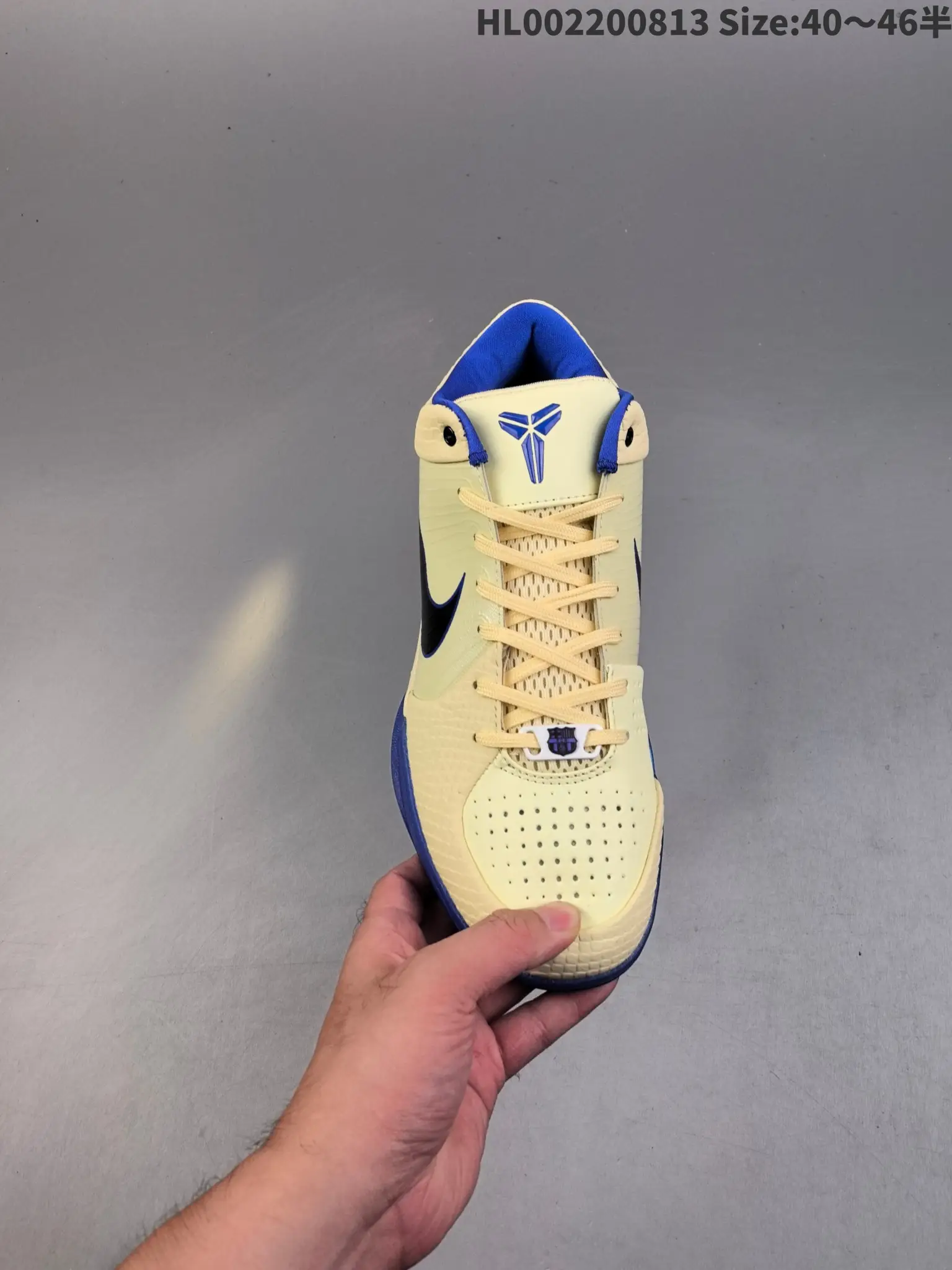 Nike Kobe 6 Protro yellow black blue synthetic sneakers with perforated toe box and signature logo on tongue