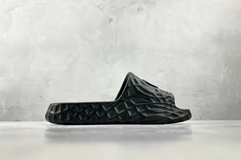 Adidas Yeezy Slide Core black EVA foam unisex slip-on sandals with textured sole
