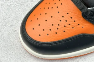Nike Air Jordan 1 Retro Shattered Backboard black and orange leather sneakers close-up view