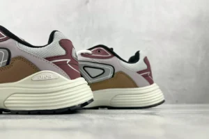 Dior B30 sneakers in white and brown color scheme, showcasing the side profile and design details, emphasizing luxury and style for e-commerce product listing.