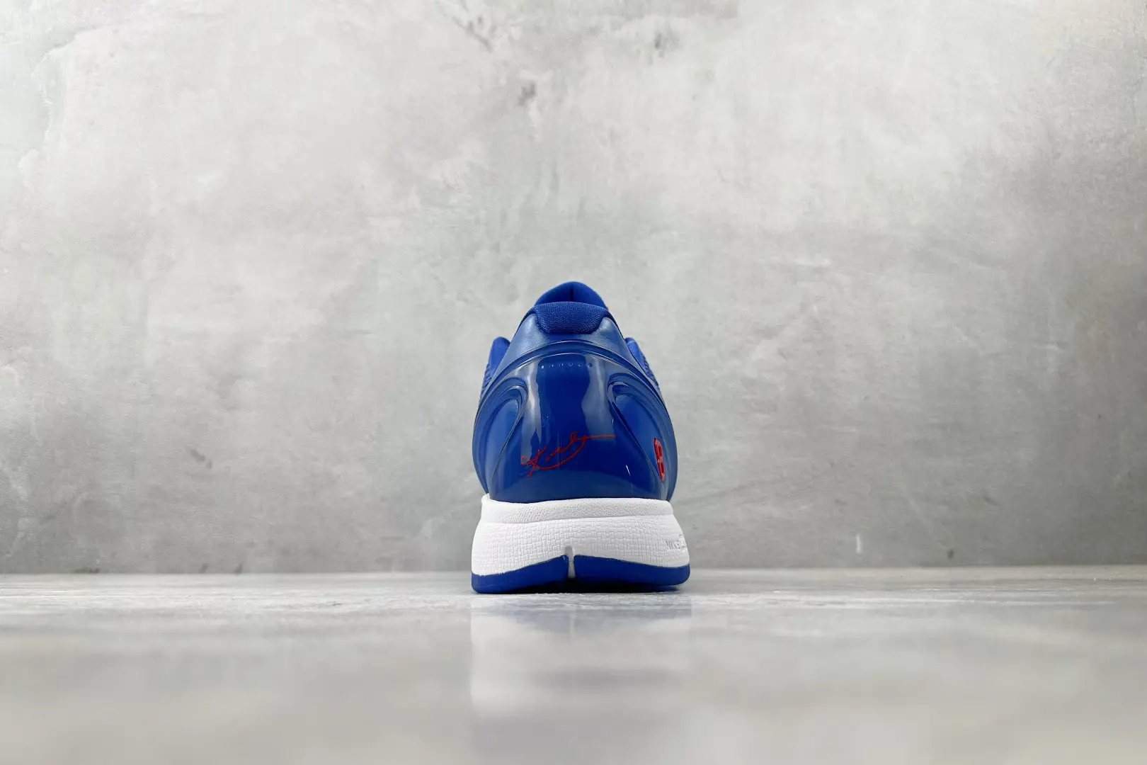 Nike Air Zoom Vomero 5 blue synthetic runners with white sole and red signature detailing
