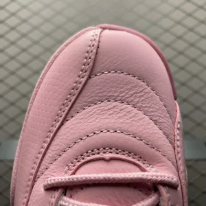 Nike Air Jordan 12 Retro Pink Quartz light pink leather sneakers with detailed stitching and laces close-up view